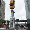 NYC's Greatest Sculpture: A 30-Foot Dalmatian Balancing A Real Taxi On Its Nose